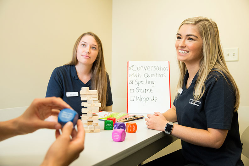 Two Elmhurst students demonstrate clinical tests.